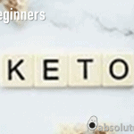 Keto for Beginners written in white on a background of scrabble tiles spelling Keto