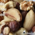 Can I eat nuts on keto? written in white against a background of nuts