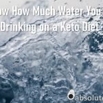 How Much Water Should I be drinking on a Keto Diet written in white on a background of blue water